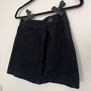 Small black corduroy skirt.